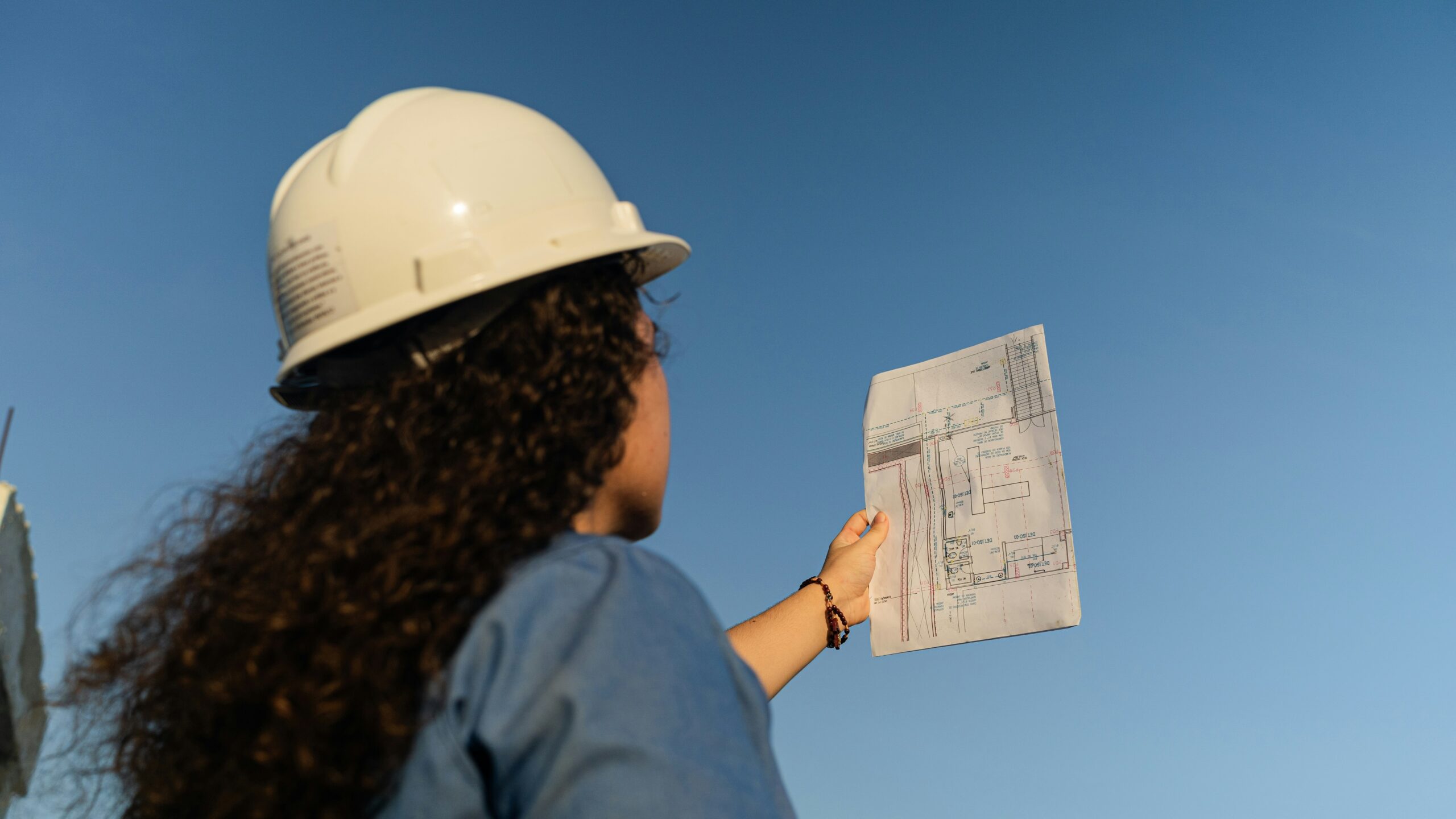Project manager reviewing plans on a construction site